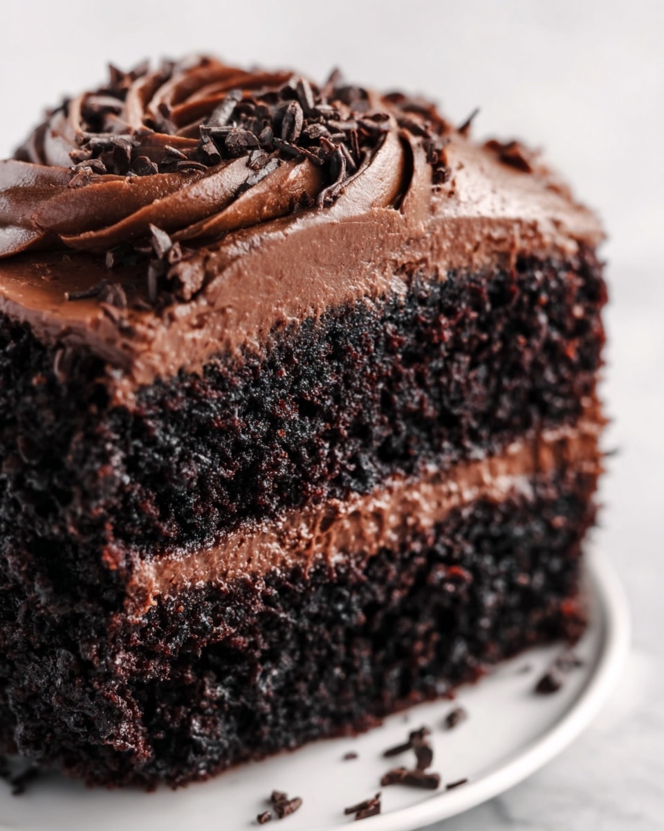 The image shows three glass dessert bowls filled with a layered dessert. Each bowl has five layers: a bottom layer of white creamy base, followed by a crumbly brown layer, a thick deep red cherry sauce layer above that, then a generous swirl of white whipped cream, topped with dark cherries, small dark berries, and chocolate shavings. A bright red cherry with a stem sits on top of the whipped cream in each bowl. Two silver spoons are placed on a white marbled surface in front of the desserts, and the background is softly blurred with warm lights. photo taken with an iphone --ar 4:5 --v 7