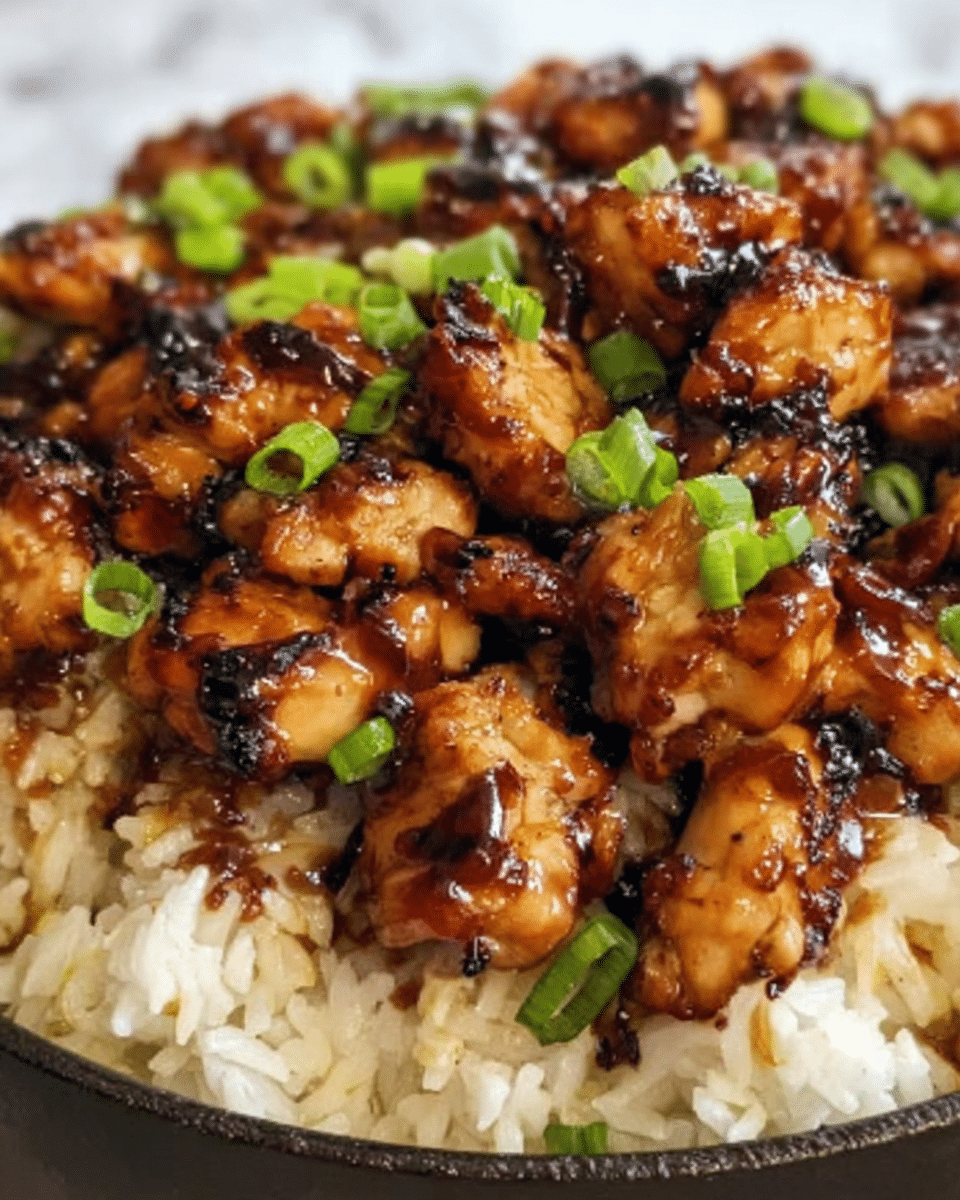 The image shows a metal pan filled with a cooked dish containing four main layers visible: the base layer is made of browned ground beef mixed with small pieces of cooked onions and diced tomatoes showing red and brown colors. The second layer includes bright orange cubes of sweet potato scattered evenly throughout. The third layer is melted cheese that is yellow-white and spread across the top, blending into the beef and sweet potato. Finally, the top layer has fresh green cilantro leaves placed randomly to add contrast and freshness. A wooden spoon is resting inside the pan, partially mixing the ingredients. The pan sits on a white marbled surface. Photo taken with an iphone --ar 4:5 --v 7
